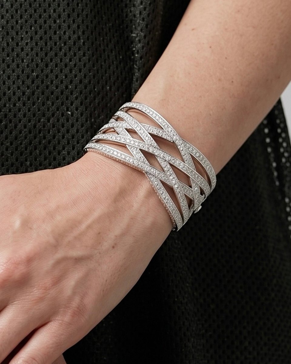 A pavé crossover cuff on the wrist