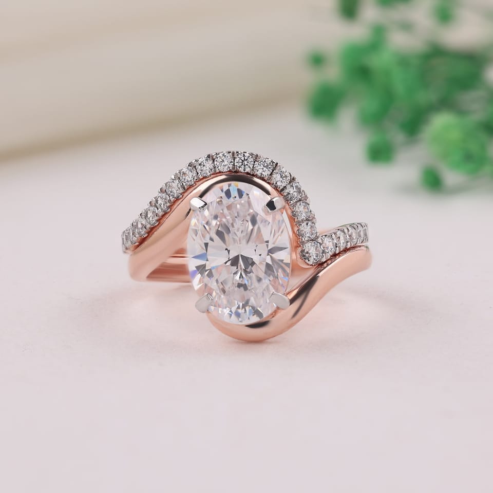 Oval Laboratory-Grown Diamond Bypass Solitaire Bridal Set, 3.32 ct total, photographed sample in 14K rose gold with white-plated claws and pavé settings, front view
