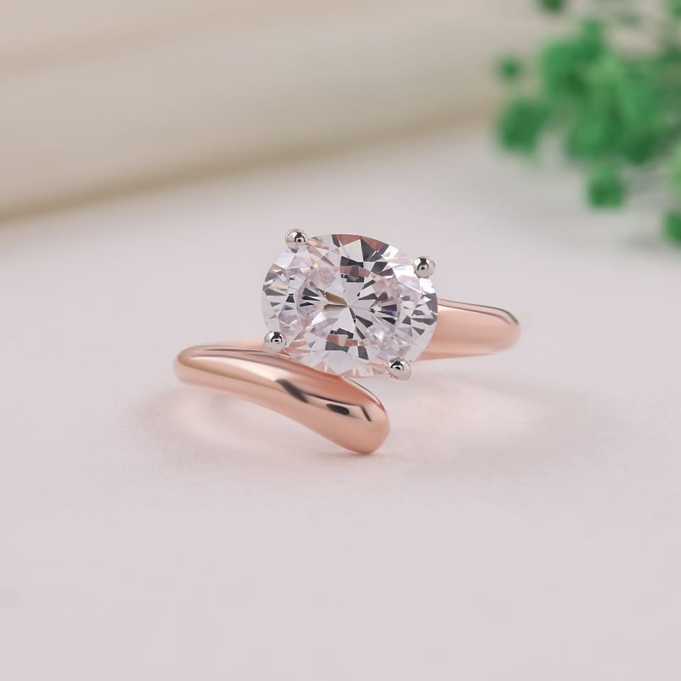 Oval Laboratory-Grown Diamond East-West Bypass Solitaire Engagement Ring, 2.50 ct, photographed sample in 14K rose gold with white-plated claw tips, front view