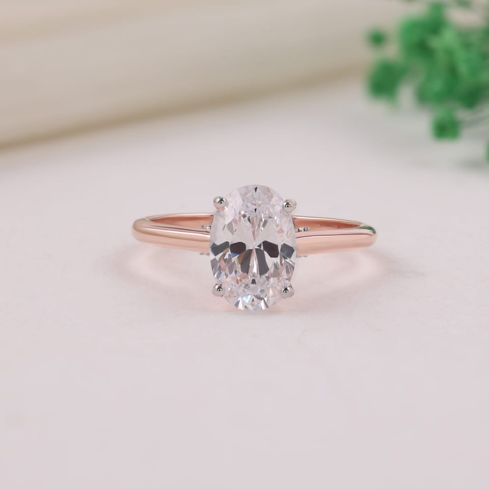 Oval Laboratory-Grown Diamond Hidden Pavé Solitaire Engagement Ring, 2.15 ct, photographed sample in 14K rose gold with white-plated claw tips and pavé, front view