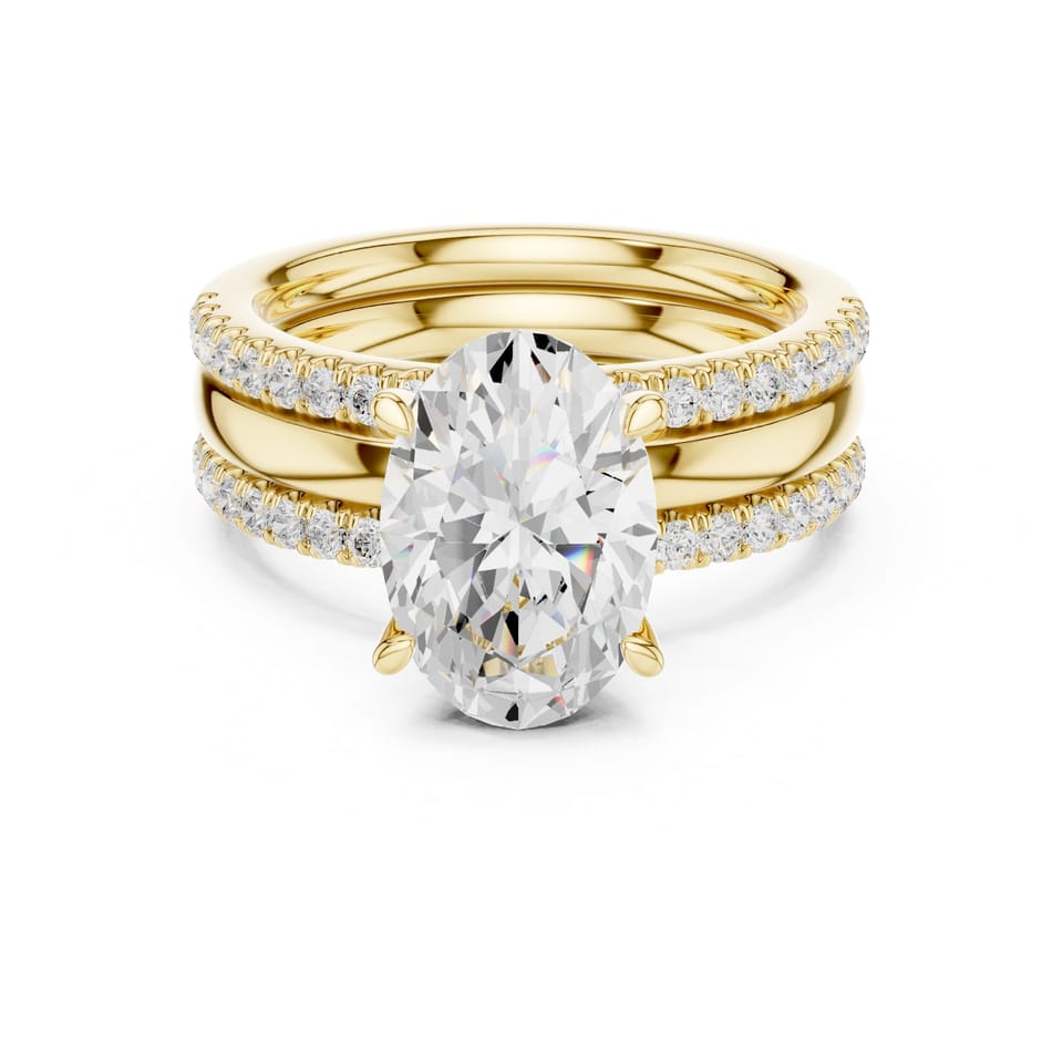 Oval Laboratory-Grown Diamond Solitaire Bridal Set with Two Pavé Bands, 4.13 ct total in yellow gold, front view