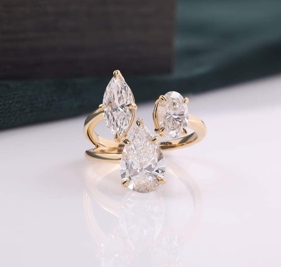 Pear, Marquise and Oval Laboratory-Grown Diamond Three-Stone Engagement Ring, 4.61 ct total, photographed sample in 14K yellow gold, front view